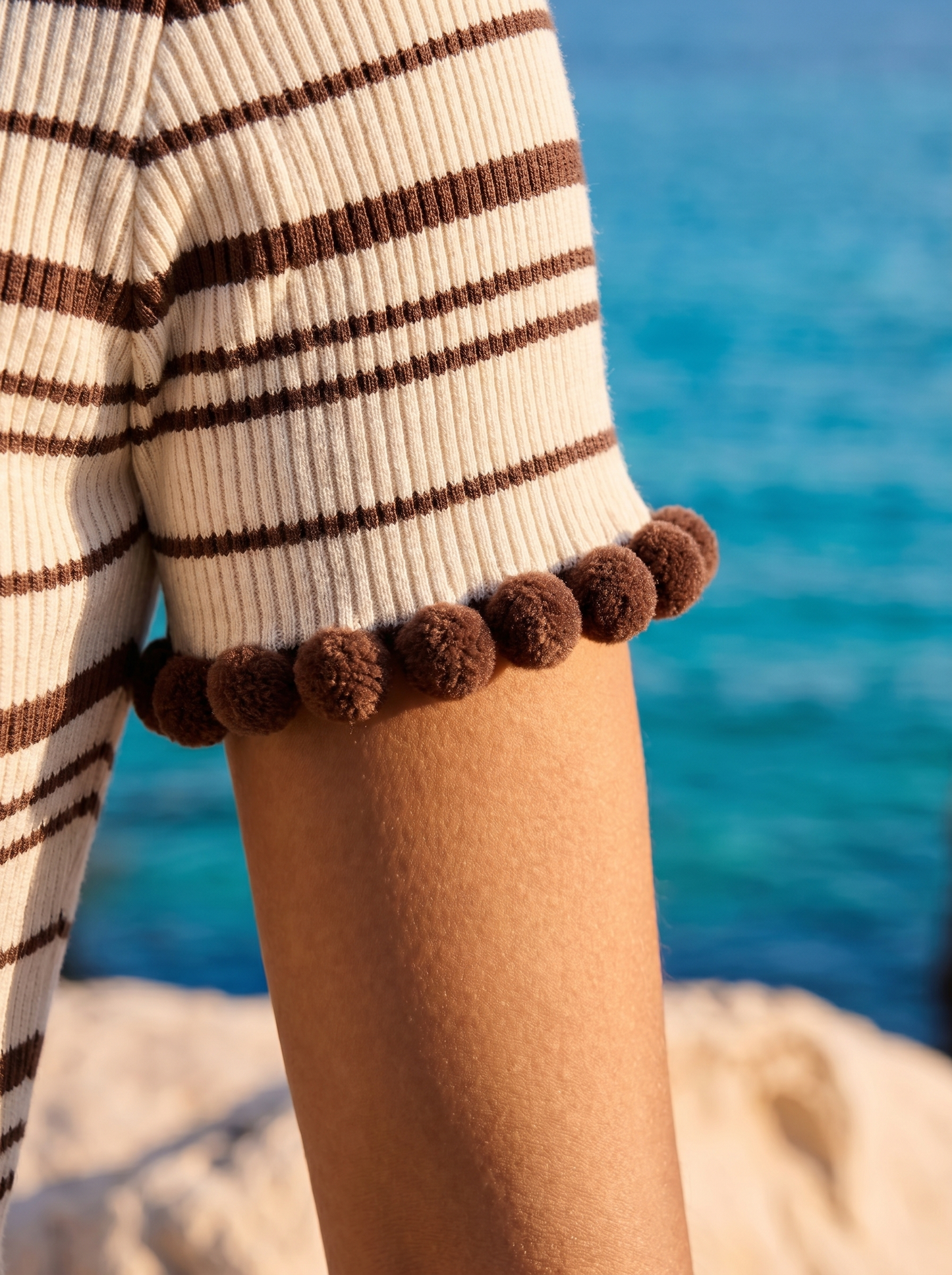 Women's Stripe Knit Top with Pom-Pom Trim at Neckline Cuffs and Hem